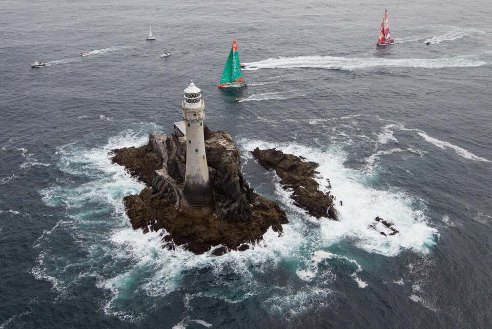 Groupama Sailing Team, skippered by Franck Cammas from France and CAMPER with Emirates Team New Zealand, skippered by Chris Nicholson from Australia, rounding Fastnet Rock, on leg 9 of the Volvo Ocean Race 2011-12, from Lorient, France to Galway, ...
